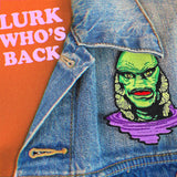 Green and Purple Creature Patch on a denim jacket