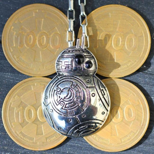 shot of the bb8 pendant on imperial coins from the star wars monopoly game
