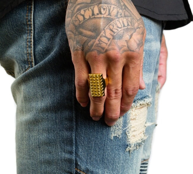 shot of a man wearing the Beater Ring in silver from the han cholo precious metal collection