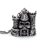 front of the castle grayskull pendant in silver from the masters of the universe collection