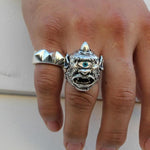 shot of a man wearing the cyclops ring and the big spike ring on his hand