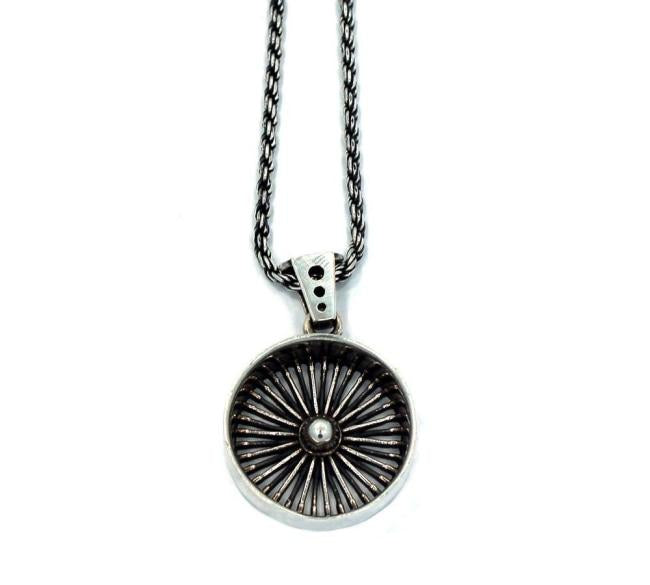 front of the Dayton Pendant in silver from the han cholo cruising collection