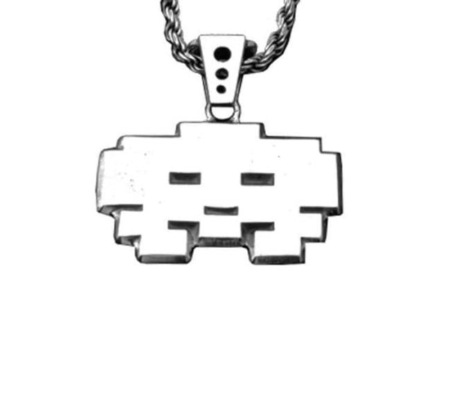 front view of the grumpy invader pendant in silver on a white background