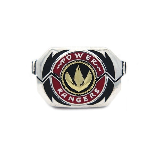 shot of the mighty morphin power rangers green dragonzord morpher coin on a white background