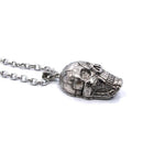 side of the Rivet Skull Pendant in silver from han cholo skulls collection