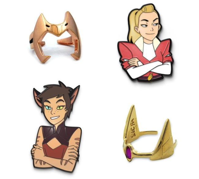 catra and adora enamel pins and she-ra rings from she-ra and the princesses of power