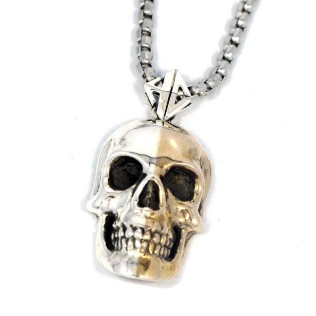 close detail of the 2 tone skull pendant from the han cholo skulls collection