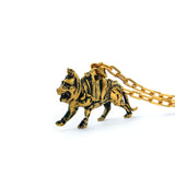 left side of the battlecat pendant in gold from the masters of the universe collection