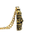 side of the castle grayskull pendant in gold from the masters of the universe collection