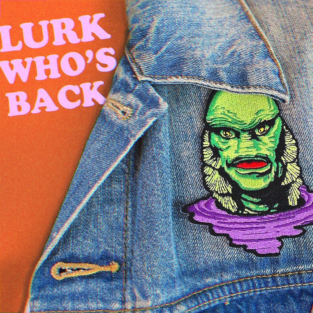 Green and Purple Creature Patch on a denim jacket