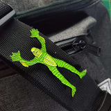 full body creature from the black lagoon enamel pin on backpack