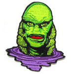 up close shot of the Creature Lurking Patch from the universal monsters jewelry collection