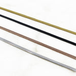 shot of the of the gunmetal, silver, gold and rose gold herring bone chains side by side on marble