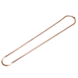 angled shot of the herring bone in rose gold laying on a white background