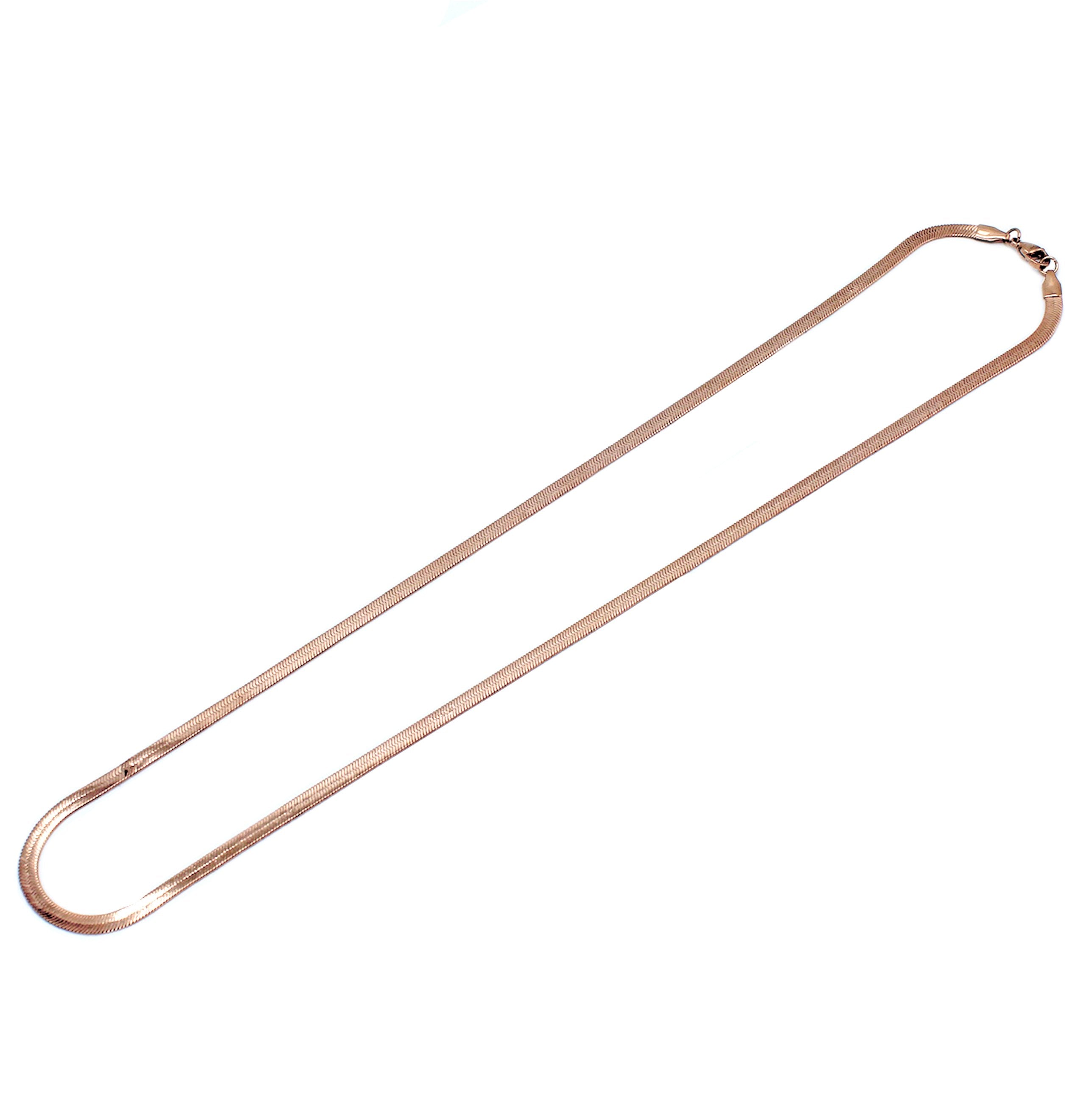 angled shot of the herring bone in rose gold laying on a white background