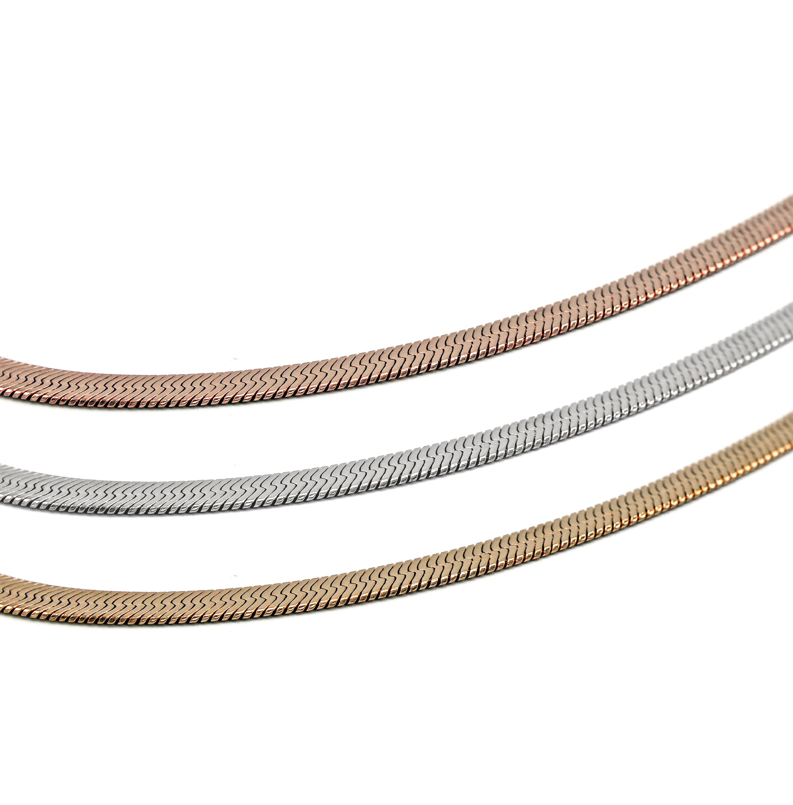 shot of the silver, gold and rose gold herring bone chains side by side