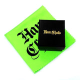 shot of the black han cholo jewelry box with a green han cholo polishing cloth