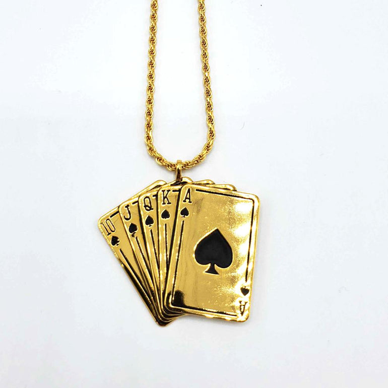 front shot of the Royal Flush Pendant in gold on a white surface
