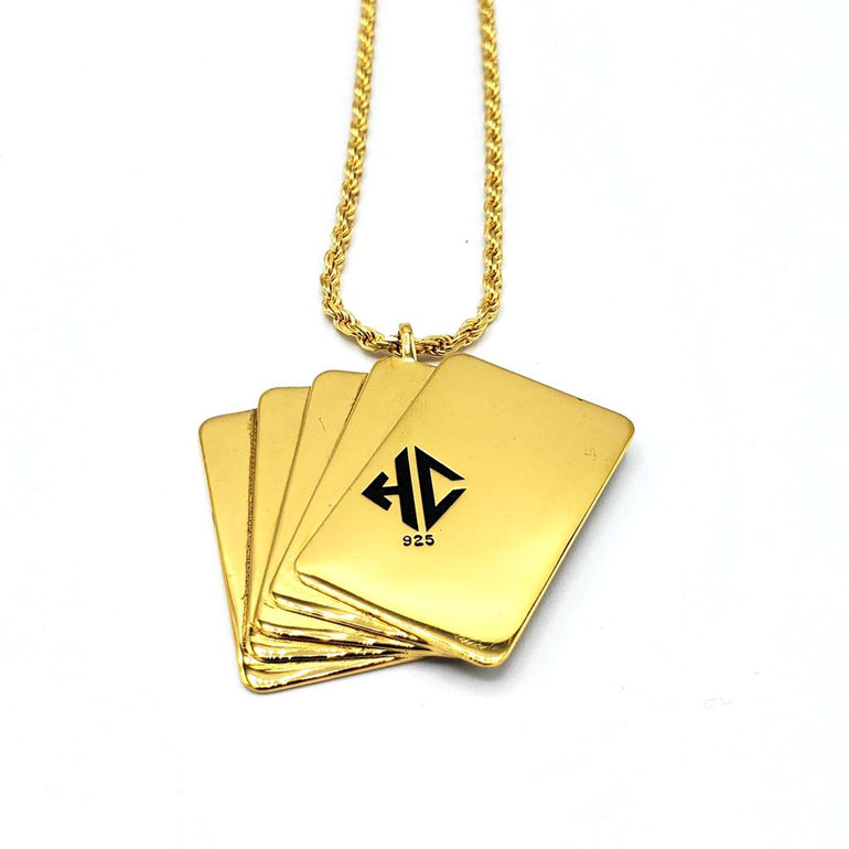 back  shot of the Royal Flush Pendant in gold on a white surface