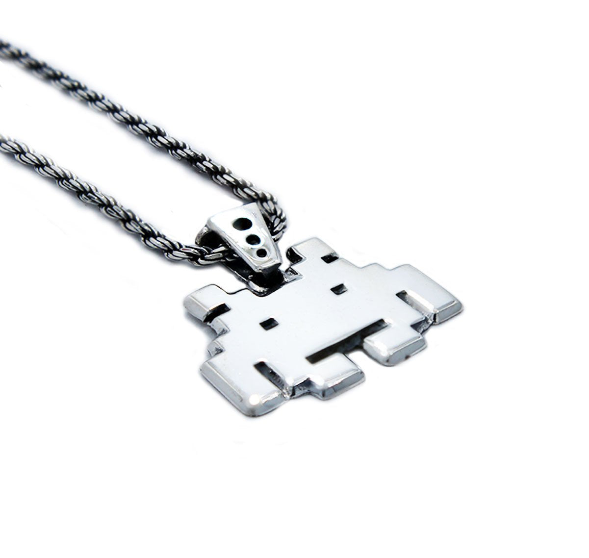 left angle view of the smiley invader pendant in silver on a white background