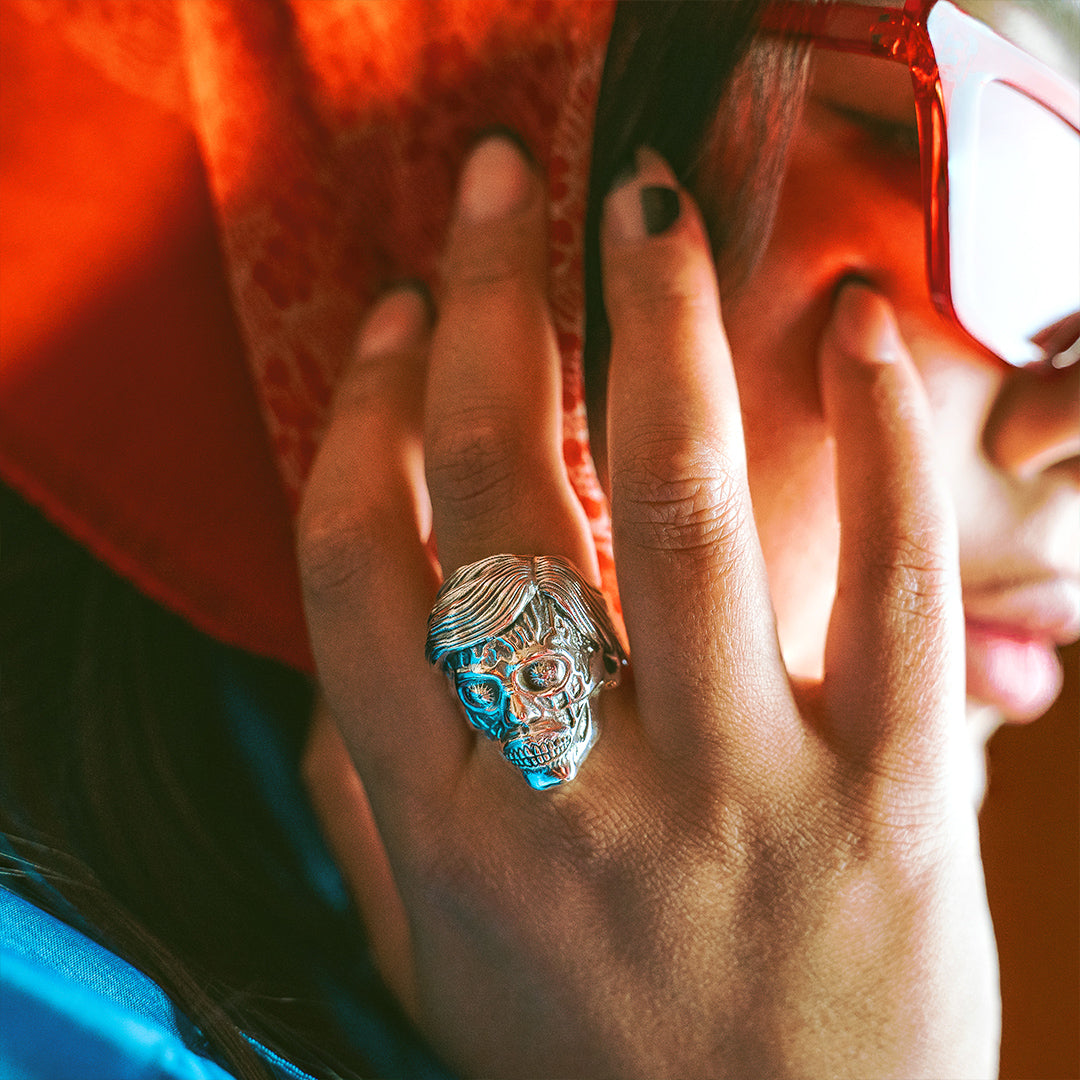 They live ghoul ring on female hand, sterling silver they live jewelry