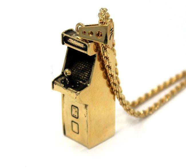 right angle view of the Arcade Machine Pendant in gold on a white background