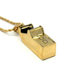bottom view of the Arcade Machine Pendant in gold on a white background