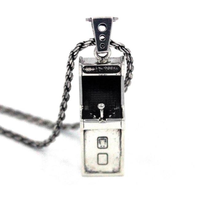 front angle view of the Arcade Machine Pendant in silver on a white background