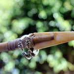 shot of the gold and silver arrow rings on an arrow