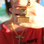 shot of a girl wearing the Baby Pyramid Ring in gold from the han cholo precious metal collection