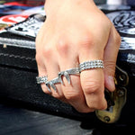 shot of a man wearing 2 of the Bandana Rings in silver from the han cholo precious metal collection
