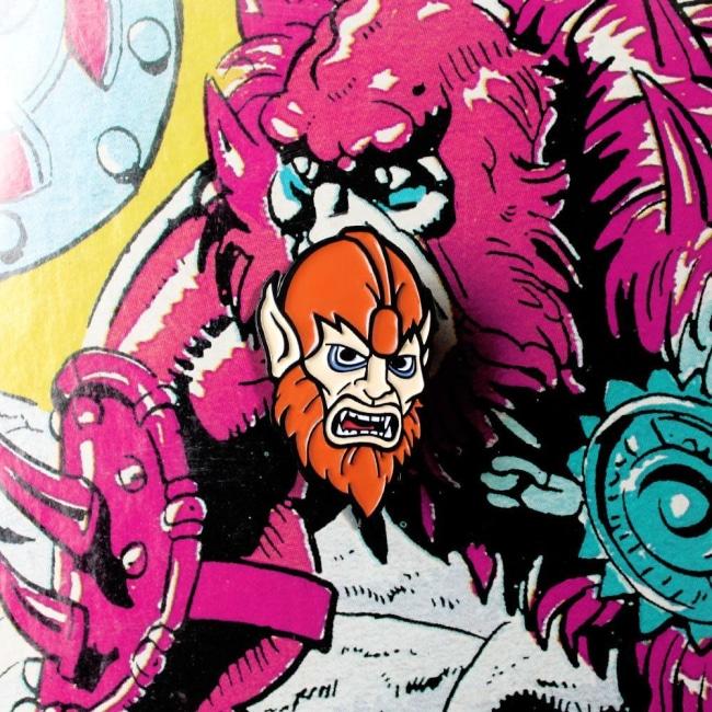 Shot of the beastman Enamel Pin on a beastman illustration  from the masters of the universe