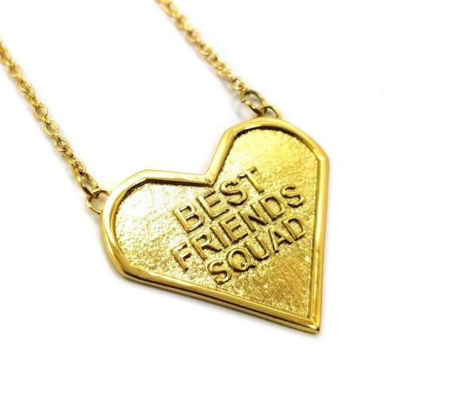 angled view of the best friends squad gold heart shaped pendant pointing to the right