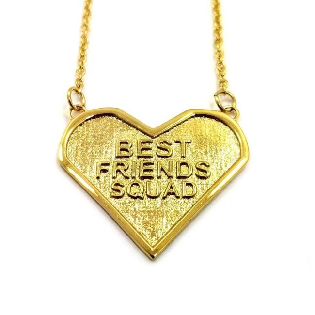 Front view of the best friends squad gold heart shaped pendant with chains on either side
