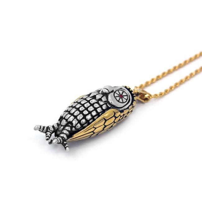 left side of the Big Bobo Owl Pendant in 2 silver and gold from the han cholo fantasy collection