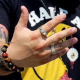 shot of a man wearing the Big Spike Ring in gold from the han cholo precious metal collection