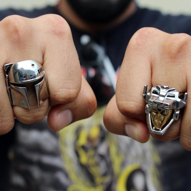 shot of a man wearing the voltron ring and boba fett ring