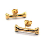 front of the Bone Earrings in gold from the han cholo shadow series collection