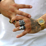 shot of a man wearing the bride of frankenstein ring and the castle grayskull ring