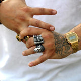 shot of a man wearing the bride of frankenstein ring and the castle grayskull ring
