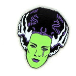close up alngle of the bride tears enamel pin from the universal monsters jewelry collection