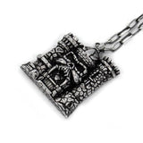 right angle of the castle grayskull pendant in silver from the masters of the universe collection