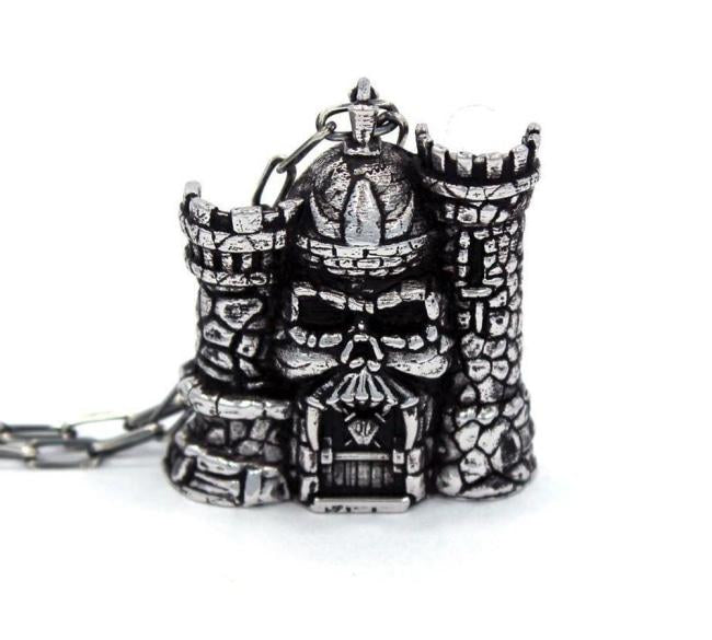 front of the castle grayskull pendant in silver from the masters of the universe collection