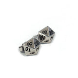 left side view of the D20 stud earrings on a white background