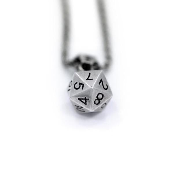 up close shot of the D20 Pendant in silver on a white background