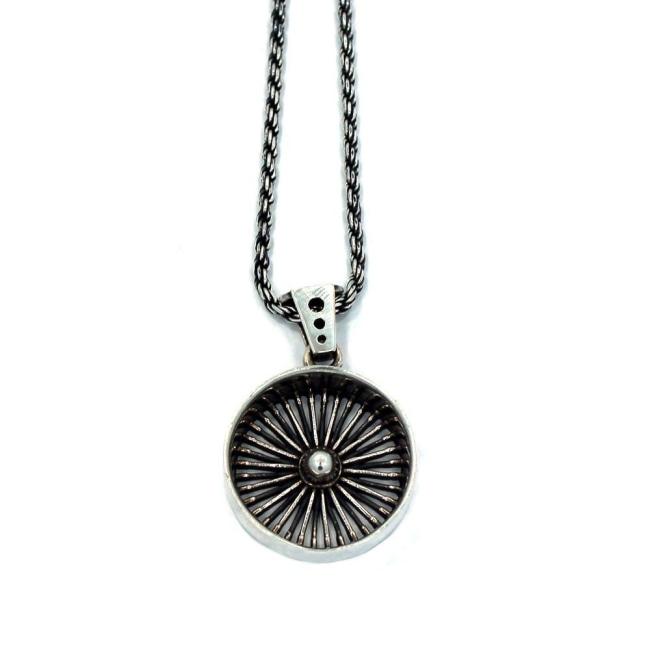 front of the Dayton Pendant in silver from the han cholo cruising collection