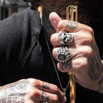 shot of a man with tattoos wearing the cali love ring dead ringer ring in silver