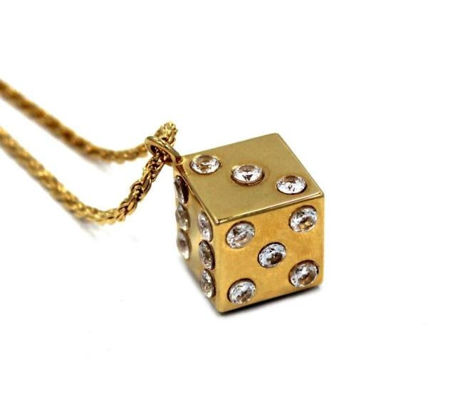 left side shot of the Dice Pendant in gold on a white background