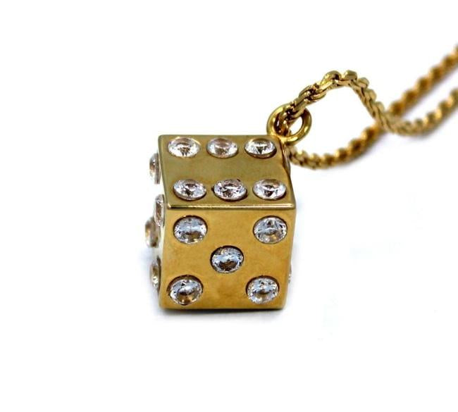 right side shot of the Dice Pendant in gold on a white background