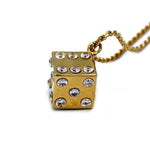  side shot of the Dice Pendant in gold on a white background